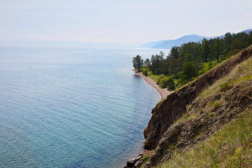 Obraz premium View above big beautiful lake, Baikal lake, Russia. Sunny summer evening
