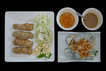 Meatball Wraps call Nam Neung served with vegetable on white plate, Vietnamese food in black background, focus selective