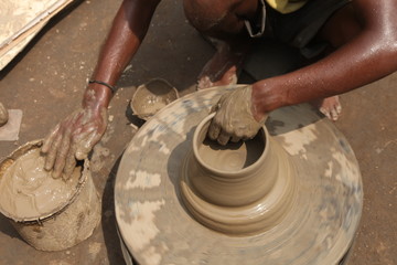 clay potter, clay molding, man plotter