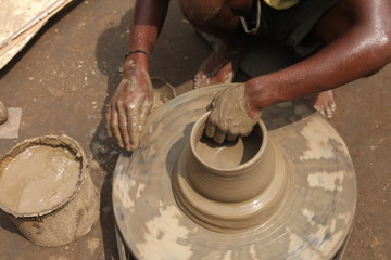 clay potter, clay molding, man plotter