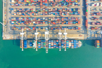 Fototapeta na wymiar Container , container ship in export and import business and logistics. Shipping cargo to harbor by crane. Water transport International. Aerial view and top view.