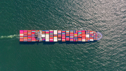 Container , container ship in export and import business and logistics. Shipping cargo to harbor by crane. Water transport International. Aerial view and top view.