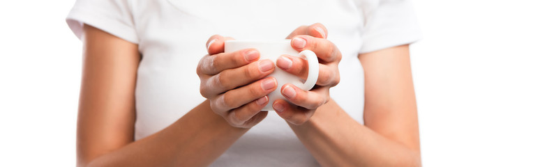 panoramic crop of woman in white t-shirt holding cup with coffee isolated on white