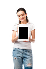 brunette woman in white t-shirt holding digital tablet with blank screen isolated on white