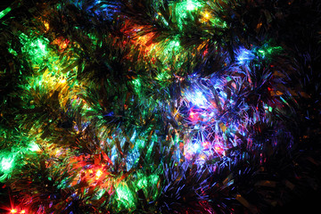 Obraz na płótnie Canvas Dark warm background of glowing christmas decorations