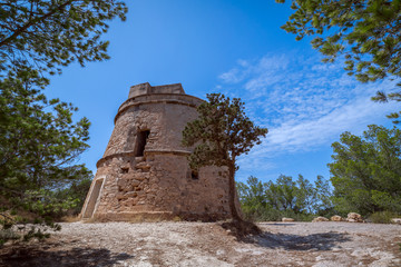 View of the old observation tower (Torre de Portinatx) of the island of Ibiza. Balearic Islands, Spain