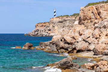 Fototapeta na wymiar Beautiful view of the lighthouse Moscarter. Ibiza, Balearic Islands, Spain