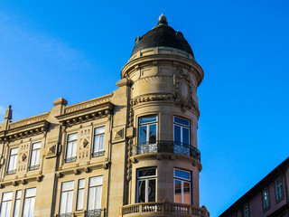 Fototapeta na wymiar A domed corner building in the historic center of Porto.