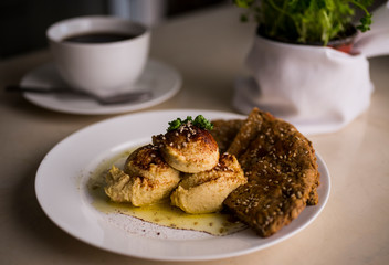 vegan hummus with nutritional bread and coffee