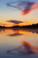 Fototapeta na wymiar Sunset on the lake, Valday, Russia. Bright orange landscape
