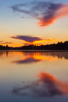Sunset on the lake, Valday, Russia. Bright orange landscape