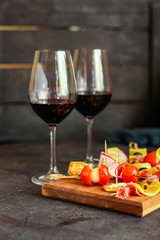 glass of wine and a snack canapes cheese plate serving size natural product portion top view place for text copy space