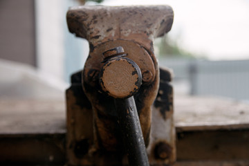 metal old vise tool set on rusty layout