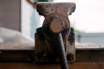 metal old vise tool set on rusty layout