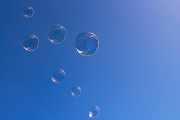 soap bubbles on blue sky