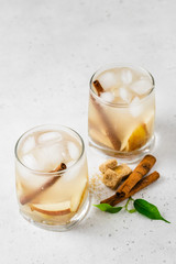 Pear prosecco cocktail in glasses. Space for text.