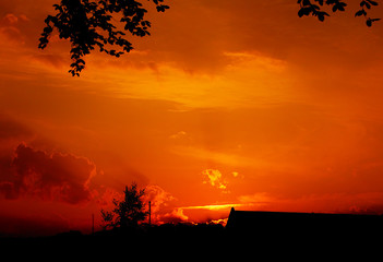 Sunset over a farm in a rural countryside