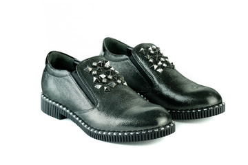 Women's red shoes from a varnish on a white background