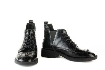 Women's red shoes from a varnish on a white background