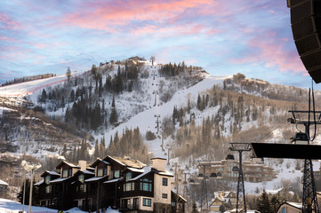 Taking the gondola to the top of the mountain in order to ski back down at a typical ski resort in the Colorado Mountains. © Guntherize