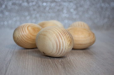 Wooden easter eggs for painting on bokeh background