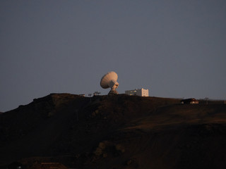 radio telescope on the mountain waiting for the night