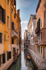Fototapeta na wymiar Beautiful venetian street in summer day, Italy