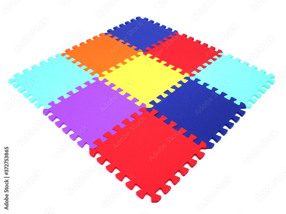 Fototapete puzzle mat - multicolored soft elements letters and numbers on a white background