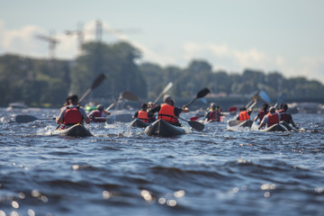 A process of kayaking in the city river canals, with colorful canoe kayak boat paddling, process of...