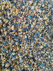 Vertical high angle shot of colorful small pebbles