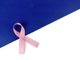 Pink ribbon on blue White background, cancer awareness poster with space for text