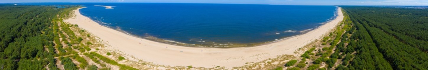 Fototapeta na wymiar Aerial view transparent turquoise sea in Baltic Sea.Summer seascapel, beach, beautiful waves, blue water at sunset. Top view from drone