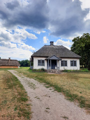 Fototapeta na wymiar Rural school 19th century. Old ethnic hut and house of Ukraine