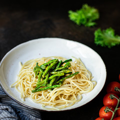 spaghetti green bean asparagus sauce cheese pasta second course vegetarian serving portion size top view copy space for text