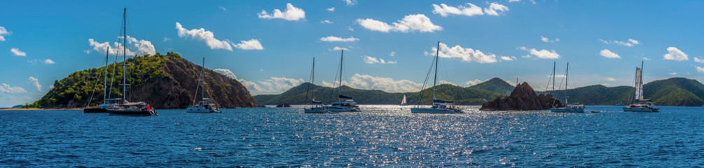 Fototapeta premium Sailboats moored off the Pelican Island and the Indian Islets off the main island of Tortola
