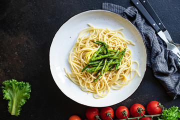 spaghetti green bean asparagus sauce cheese pasta second course vegetarian serving portion size top view copy space for text
