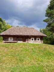 Plakat Old ethnic hut and house of Ukraine