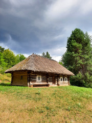 Plakat Old ethnic hut and house of Ukraine