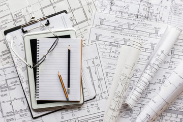 architect design working drawing sketch plans blueprints and making architectural construction model in architect studio,flat lay