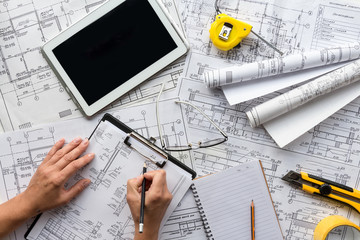 architect design working drawing sketch plans blueprints and making architectural construction...