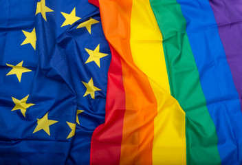 Fabric European Union EU and Rainbow flags, concept picture about human rights - obrazy, fototapety, plakaty