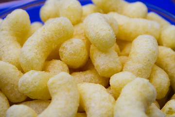 Sugar corn sticks on a glass plate.