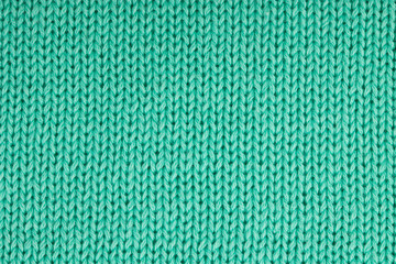 plain knitted fabric made of mint-green cotton yarn