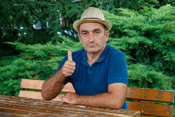 Middle Age Man With Raised Thumb