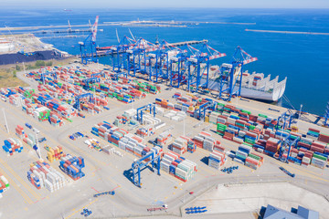 Aerial top view container cargo ship, in import export business logistic and transportation by...