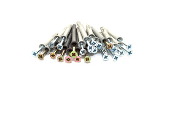 Bunch of different dowel nails for attaching to dense materials. Type of fixture in construction. Isolated on white background.