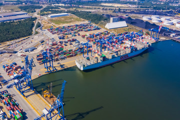 Container ship in import export and business logistic, By crane, Trade Port, Shipping cargo to harbor, Aerial view from drone, International transportation, Business logistics concept