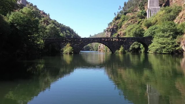 Aerial view of the Filipina Bridge of Pedr&oacute;g&atilde;o Grande - Portugal  
Drone under the bridge - Rio Zezere