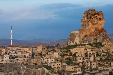 View over the ancient houses and cave dwellings in the town Ortahisar, Cappadocia, Turkey