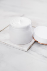 Beauty Cosmetic Cream Jars On Marble